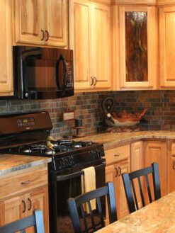 Oak kitchen cabinets rustic brown gray mosaic tile madura gold granite countertop BA1063