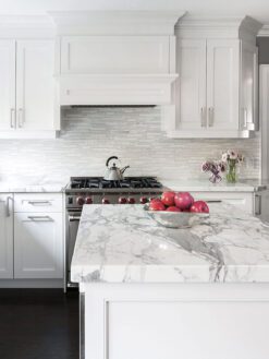white kitchen cabinets white marble backsplash tile