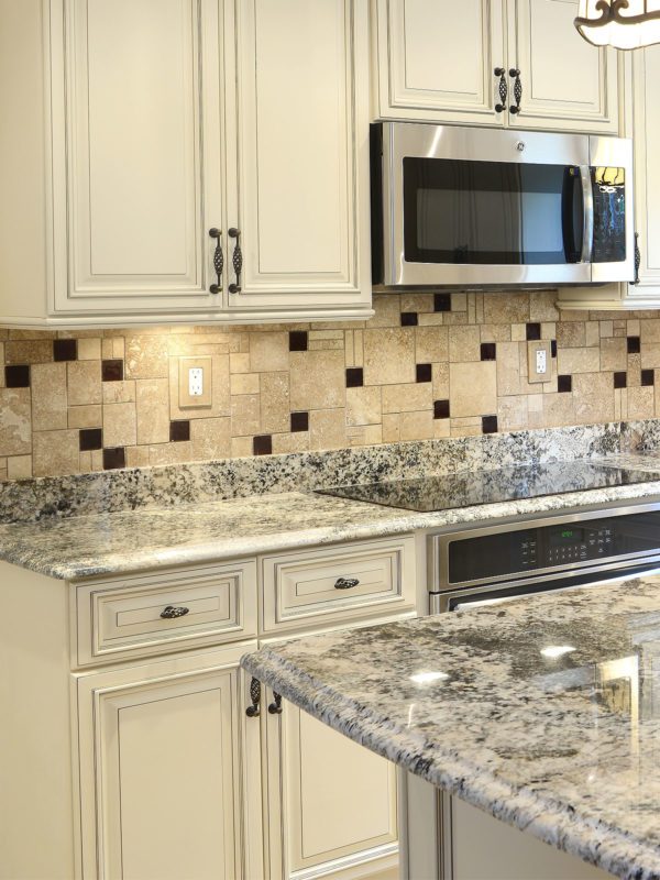 Beige cabinets granite countertop travertine glass backsplash tile 6 BA1043