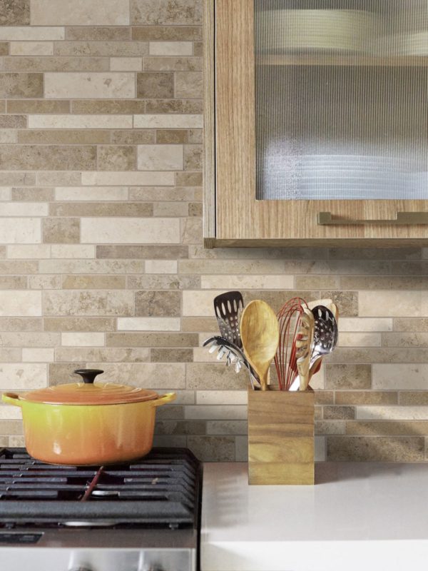 white quartz countertop with travertine brown backsplash tile