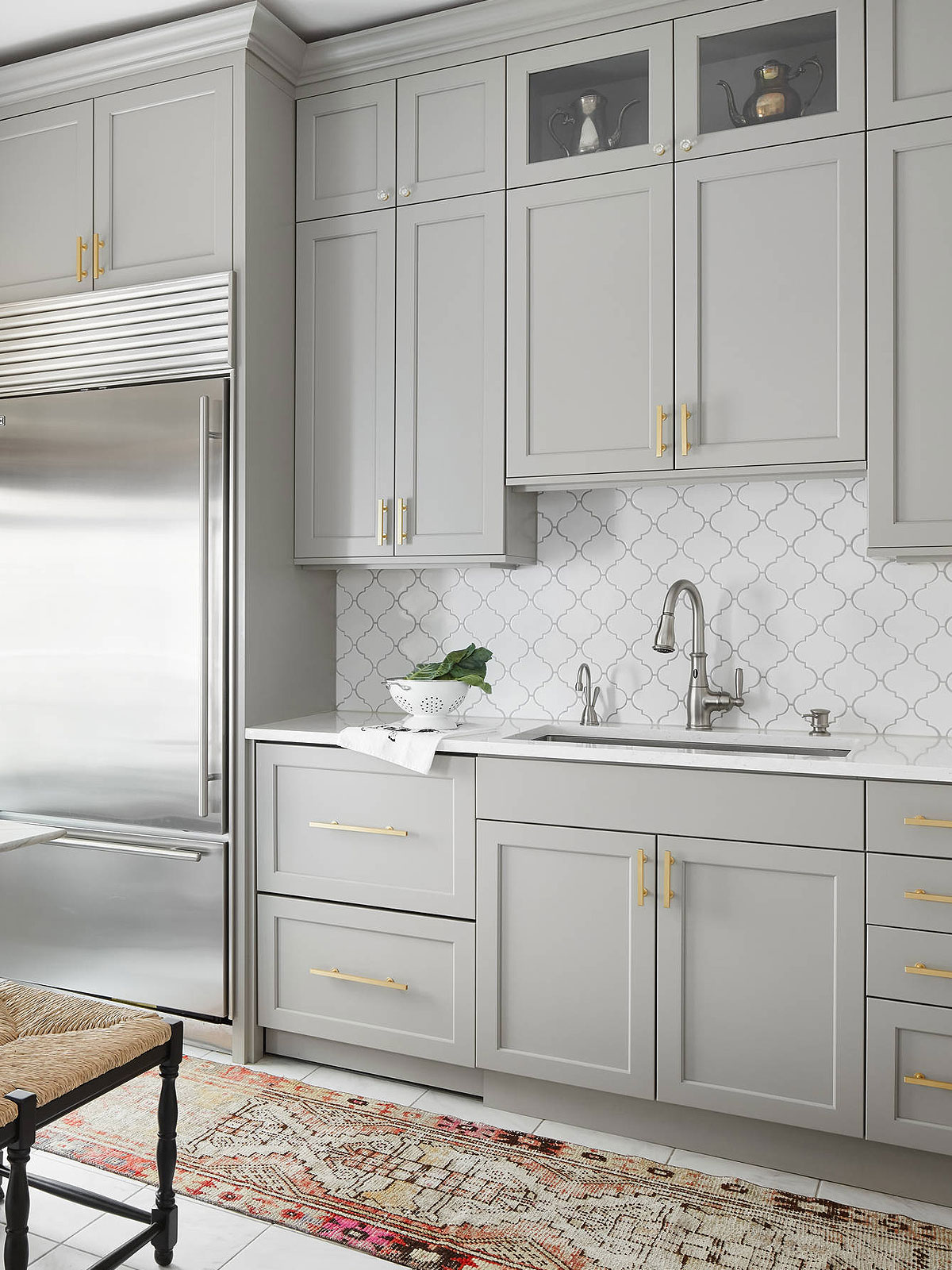 Modern gray cabinet with white arabesque backsplash tile 2