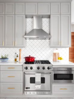 Modern gray cabinet with white arabesque backsplash tile