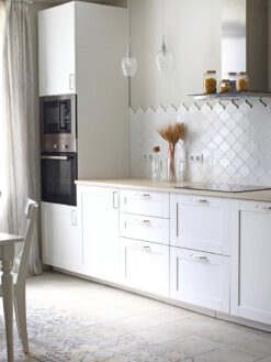 White arabesque backsplash tile white kitchen