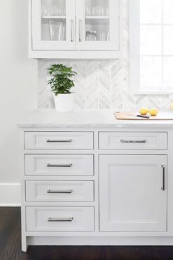 White Kitchen Cabinets Marble Countertop Chevron Backsplash Tile