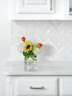 white marble countertop cabinets with white chevron backsplash tile BA631613