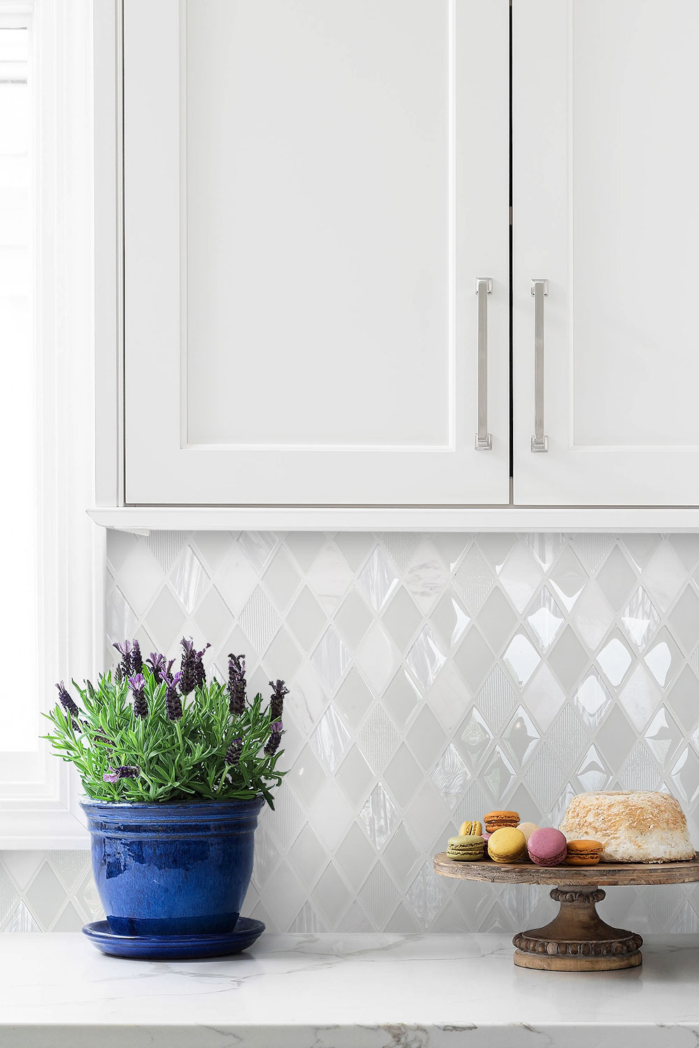 Marble Countertop White Cabinet And Backsplash